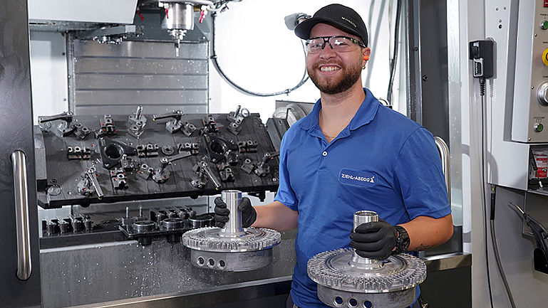 Enjoying work at ZIEHL-ABEGG An employee at work laughing
