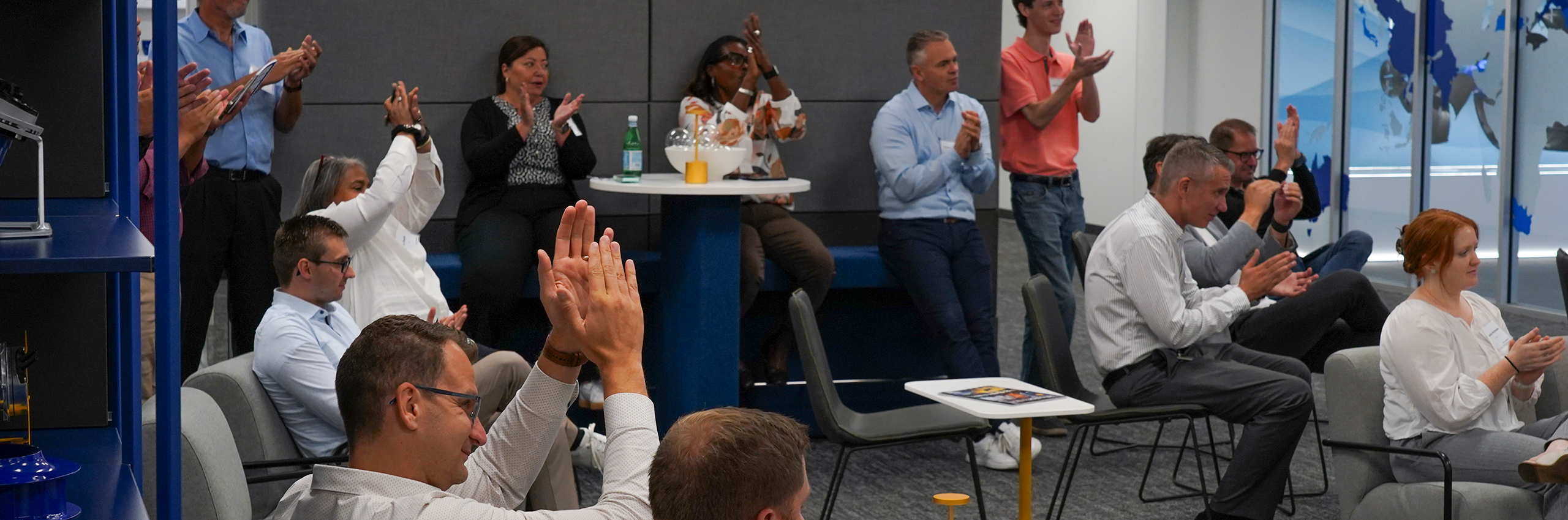 Attractive Services ZIEHL-ABEGG employees clapping and laughing